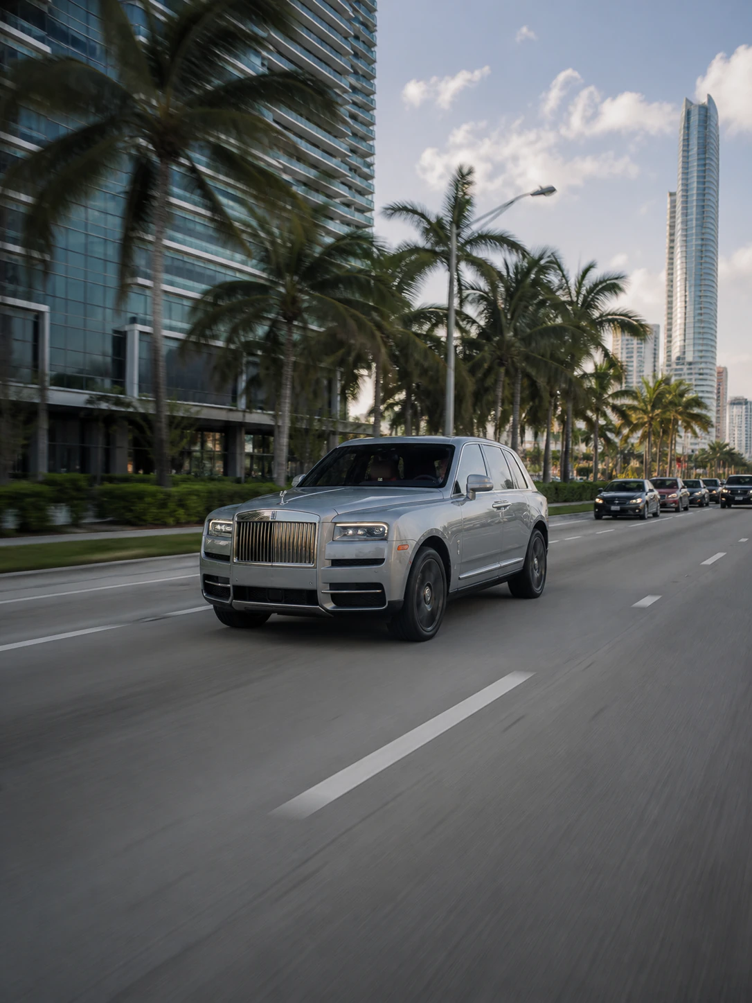 A silver Rolls-Royce driving through Miami during a day-in-the-life shoot