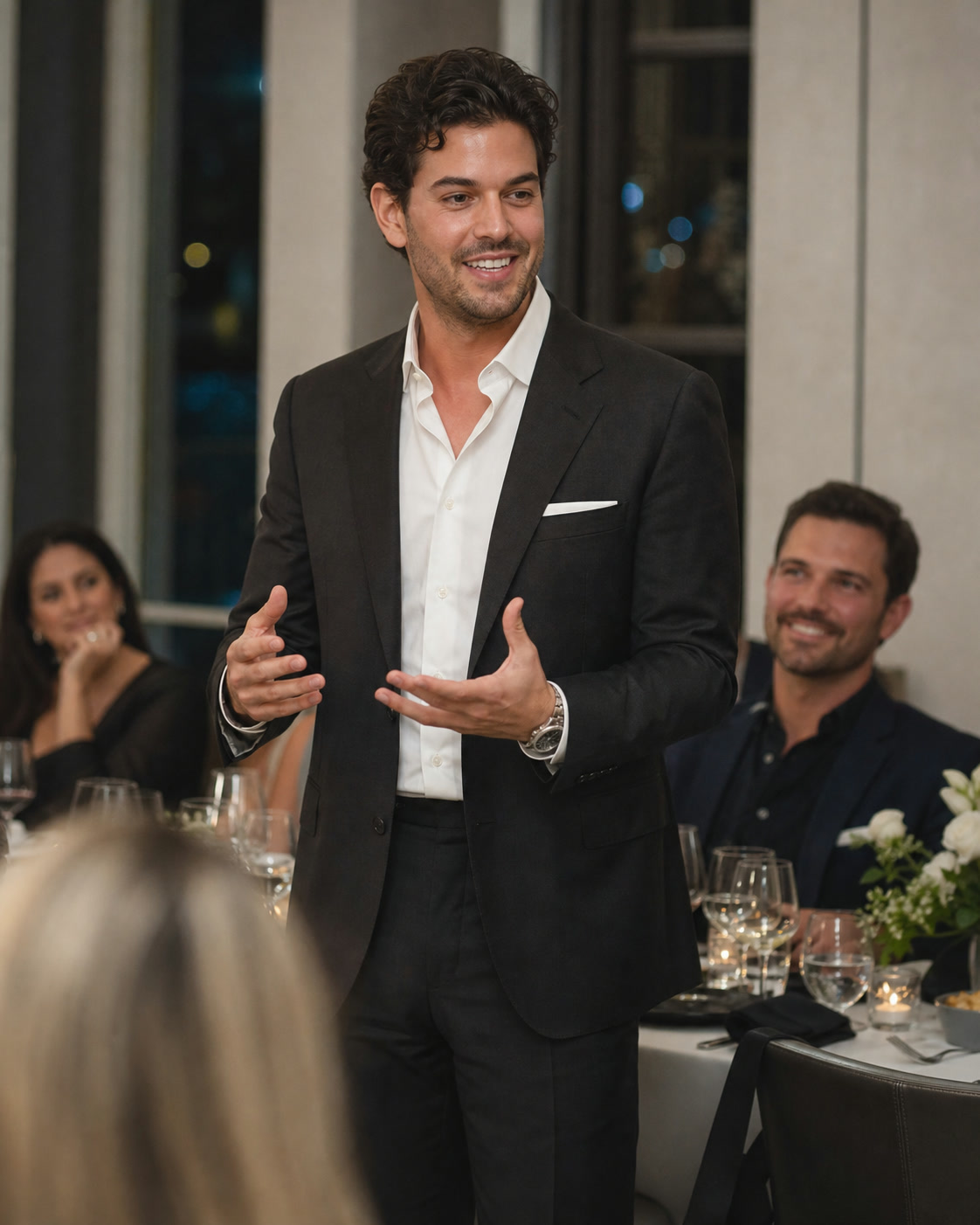 An entrepreneur speaking during an intimate business dinner in Miami
